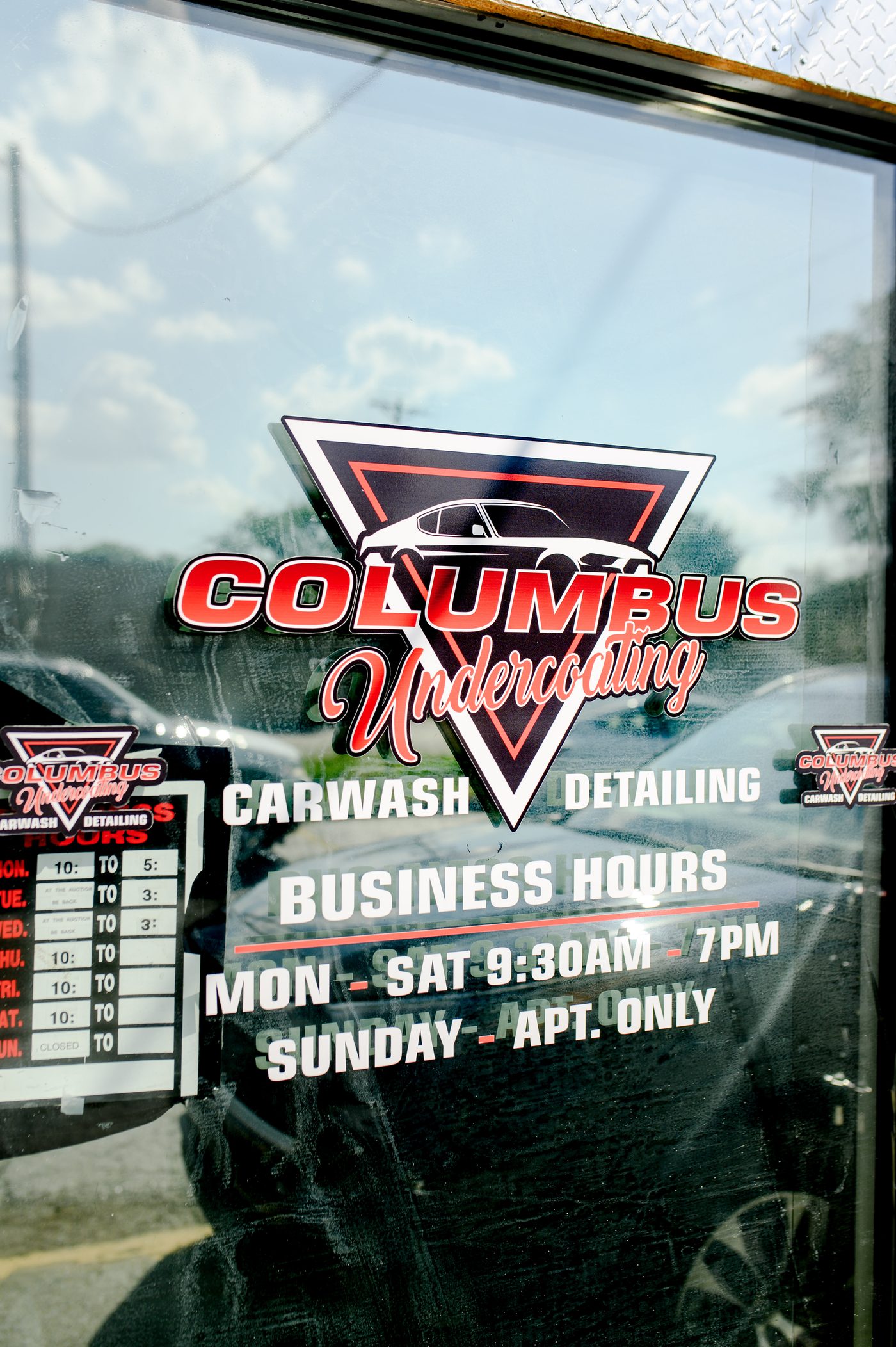 Columbus Undercoating shop door with business hours